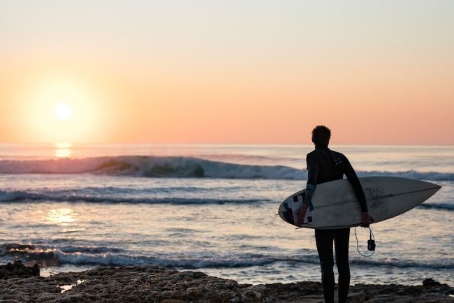 Surfer looking out at the sea. 