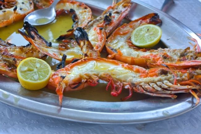 Seafood on the cliffs of Ericeira. Eating a meal while enjoying the Ericeira view.