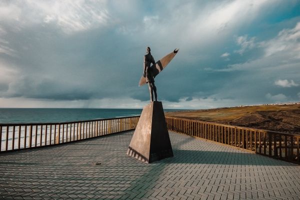 The Surfer Statue at Praia de Ribeira D'Ilhas