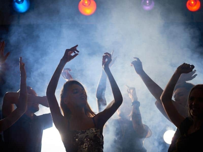 People dancing through the smoke on the dancefloor-Ericeira nightlife