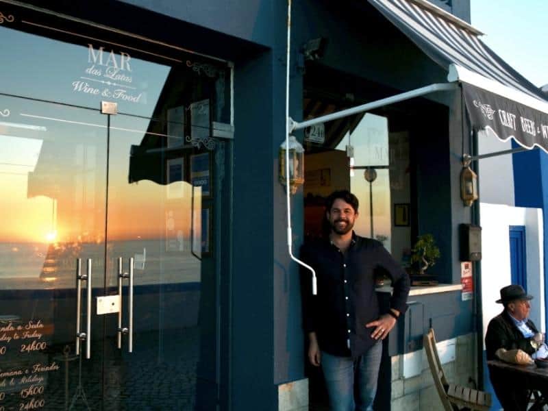 MIguel standing in front of the wine bar and restaurant, Mar das Latas is an integral part of Ericeira's wine bar scene