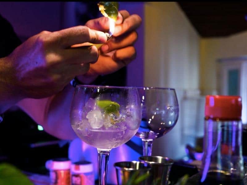Bandeja the barman, making a cocktail in his cool bar.