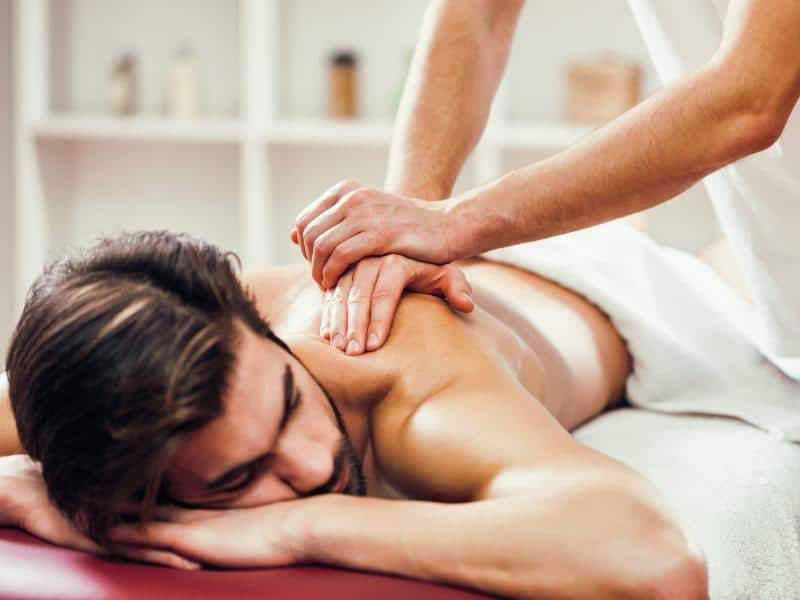 Man receiving a deep tissue massage and sports massage.