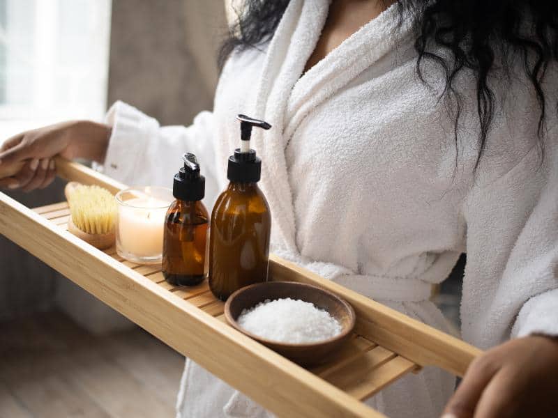 Woman holding a tray with things to have a massage.