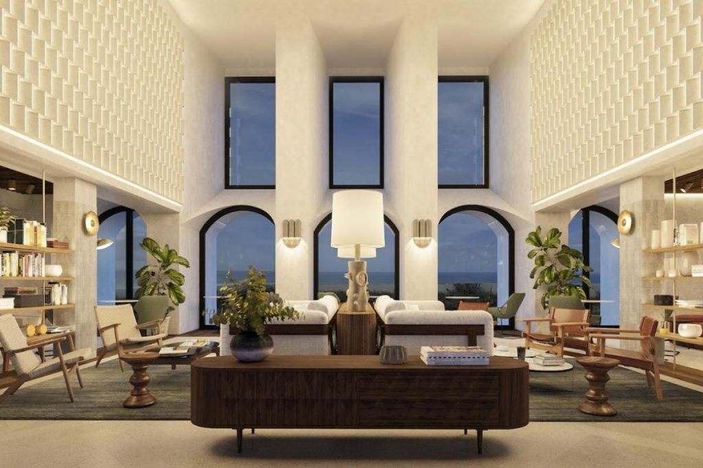 The many sofas, lamps, plants and windows in the design reception area at Aethos hotel near Ericeira.