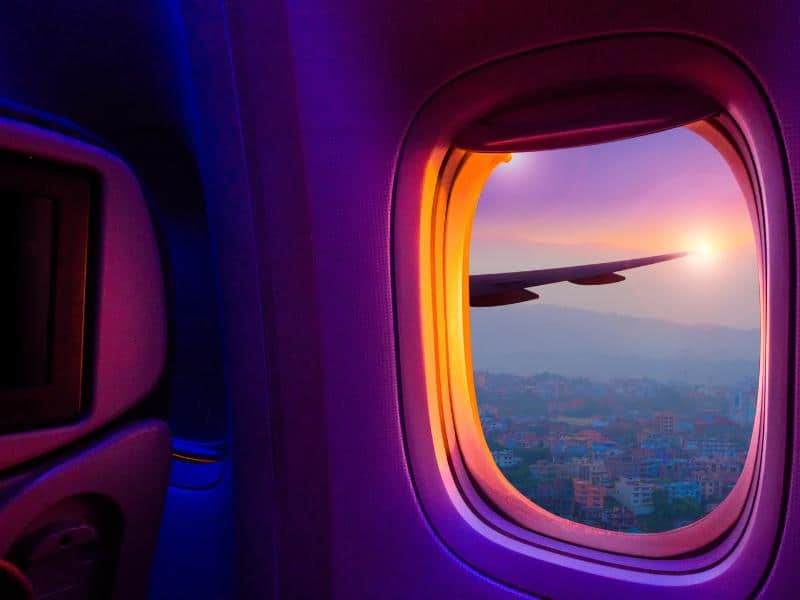 View of the wing tip in the sky from inside an airplane going from Lisbon to Porto.