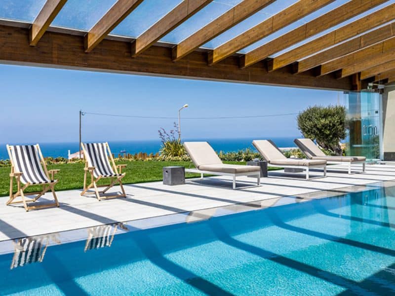 The pool with a view of the ocean in the distance.
