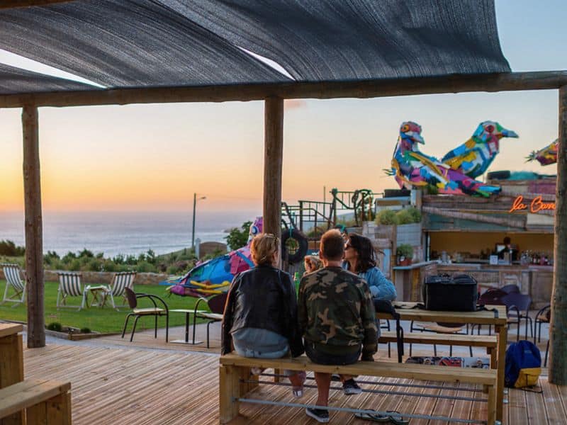 A couple enjoying the sunset in the Outdoor bar.