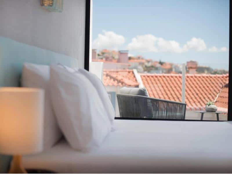 The bed and view from the FHL Hotel, one of the Boutique Hotels Ericeira