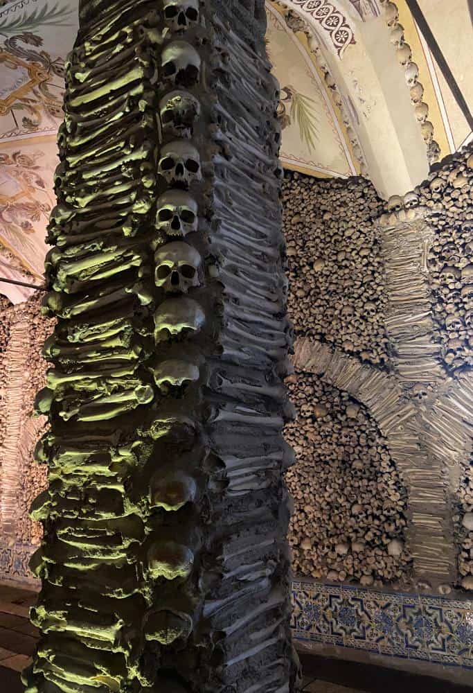 The skulls and bones used to decorate the interior of the small chapel. The chapel of bones is the number one attraction when considering what to do in Evora Portugal.