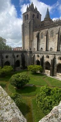 The cloister courtyard as seen from above the cloister walls on a cloudy day.