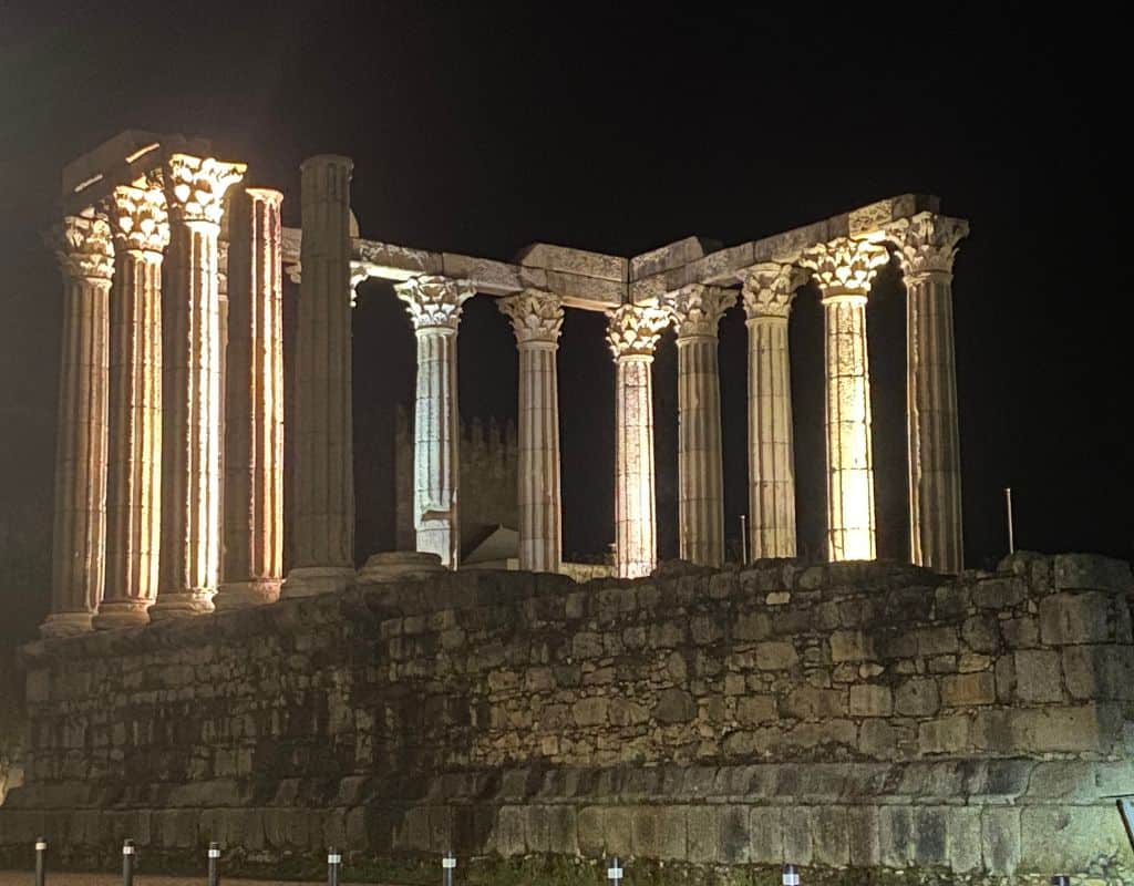 The Roman Temple of Diana beautifully lit at night. This is one of the monuments visited by all Evora tours.
