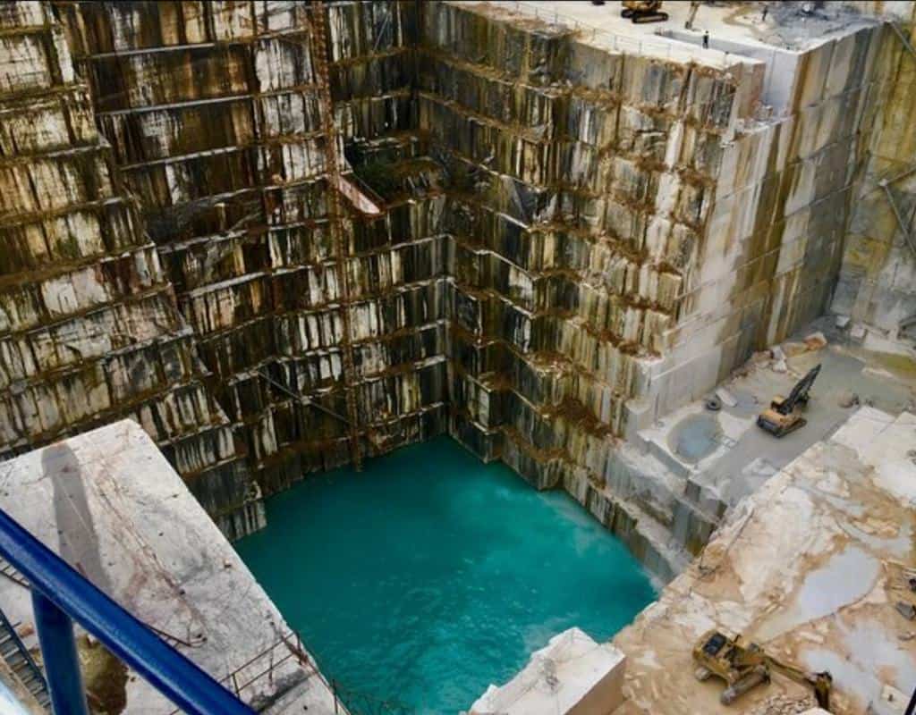 The turquoise water which accumulates at the bottom of the marble quary. The Marble quary tour is one of the best Evora tours in the area.