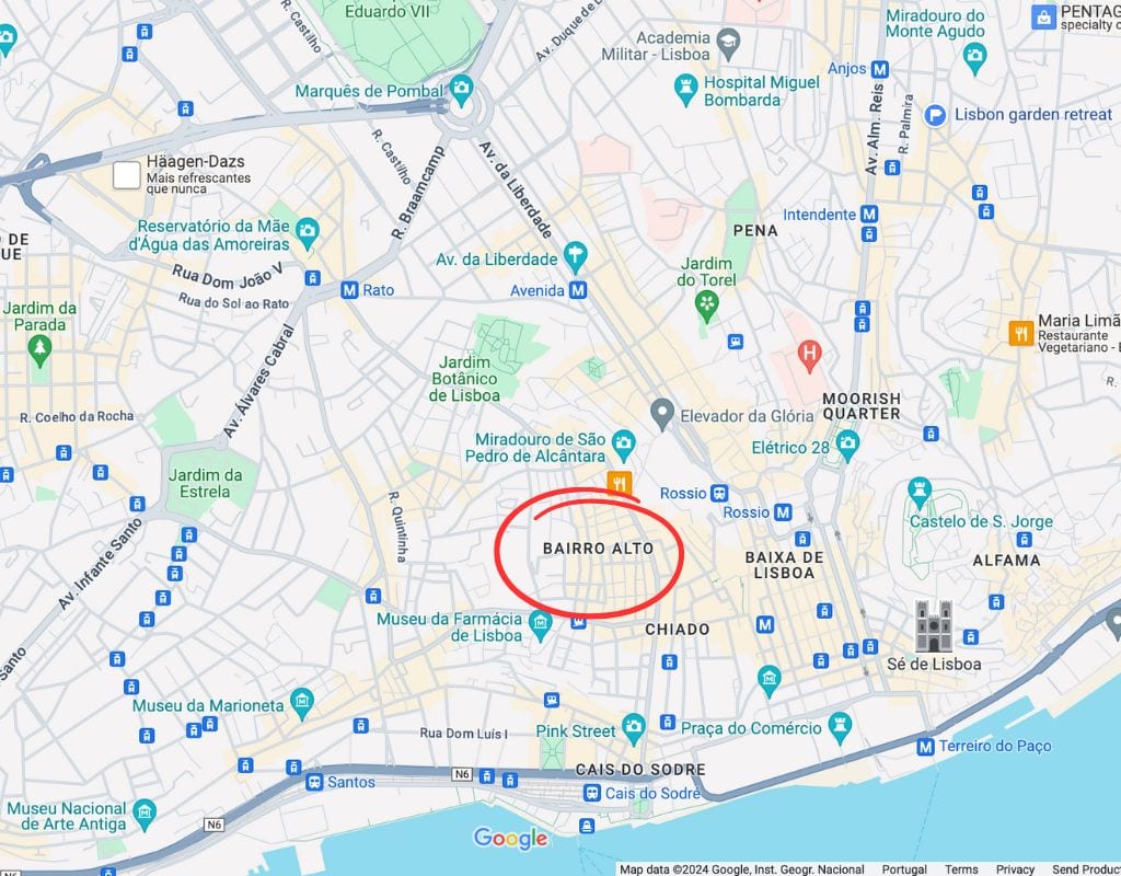 A map of Lisbon, Portugal, highlighting various landmarks and neighborhoods. The Bairro Alto area is circled in red, located near the center of the map. 