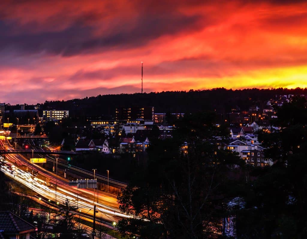 Cars speeding at twilight on the highway in Oslo. Oslo is one of the most stressful cities for drivers in Europe.